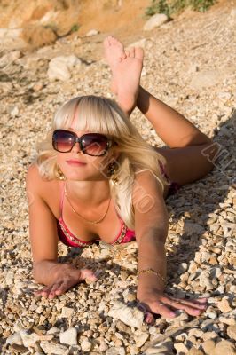 The sexual young blonde girl on a beach