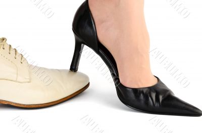 Black female heel on a white men`s socks