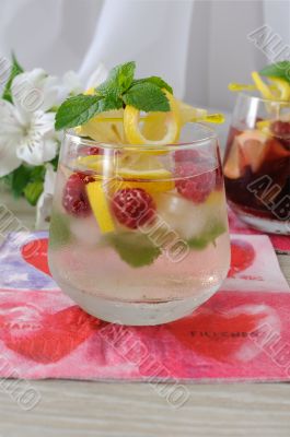Fresh homemade lemonade with mint and raspberries