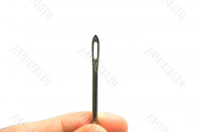 Hand holding a Sewing needle