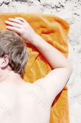 Man sleeping on beach