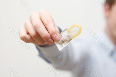 Man holding condom