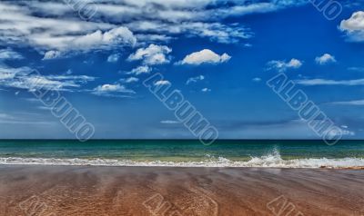 A tropical beach with blue sea