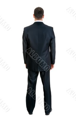 Businessman standing with his back to the studio