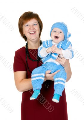 grandmother with her grandson in her arms in the studio