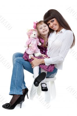 Mother and daughter sitting on a chair