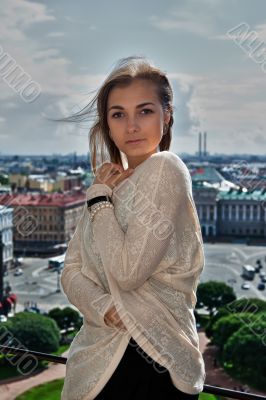 Portrait of a beautiful girl on the roof