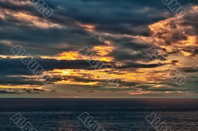 sunset on an overcast sea 