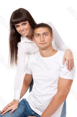 Portrait of happy young couple, hugging, smiling.?