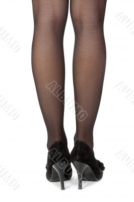 female feet in shoes with heels, rear view
