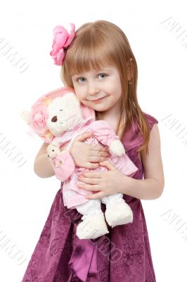 portrait of a little girl 4 years old with a plush toy
