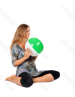 Pregnant girl in an inflatable ball color