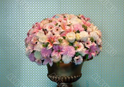 bouquet of flowers in a brass vase