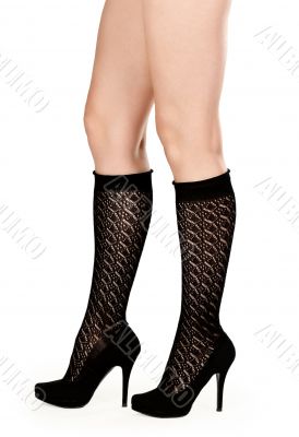 female legs in fishnet socks and shoes