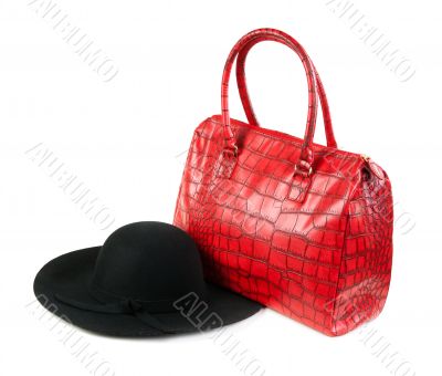 Red Fashion ladies handbag and a black felt hat