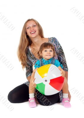 Mother and daughter playing in an inflatable ball
