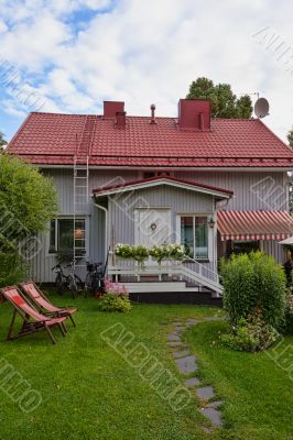small house with a tiled roof