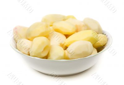 Peeled potatoes on plate