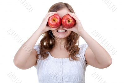 Woman holding two red apples for eyes