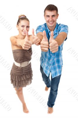 Young happy couple showing ok