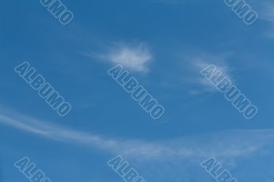 White cloud in the sky with the shape of a smile