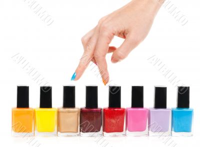 Female hand fingers are the colored paints polish