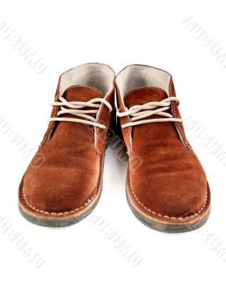 a pair of brown suede shoes