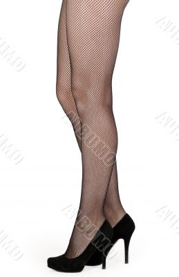 Beautiful female legs in pantyhose and shoes with heels