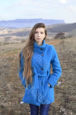 Girl in a blue coat