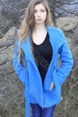 Girl in a blue coat
