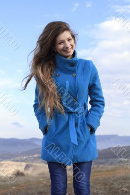 Girl in a blue coat