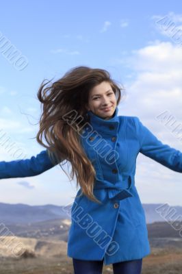 Girl in a blue coat