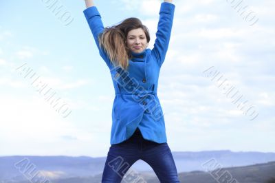 Girl in a blue coat