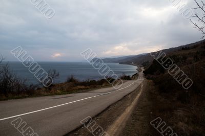 Road running along the sea