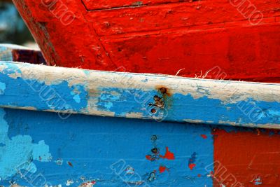Peeling paint on rusted metal surface