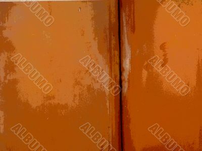 Peeling paint on rusted metal surface