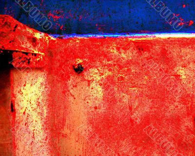 Peeling paint on rusted metal surface