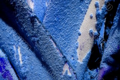 Peeling paint on rusted metal surface