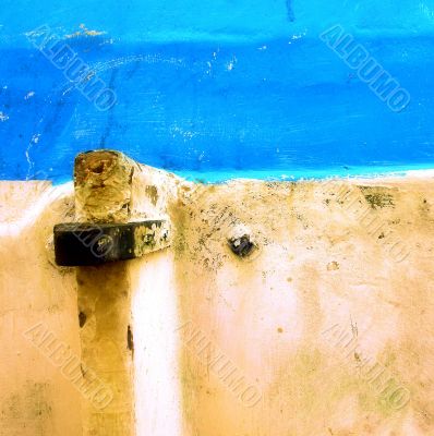Peeling paint on rusted metal surface
