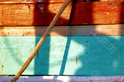 Peeling paint on rusted metal surface