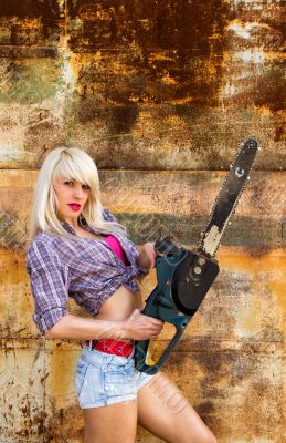 Sexy Girl holding a chainsaw