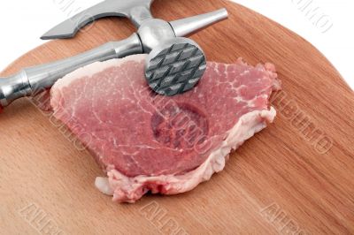 meat cleaver in fresh pork chops