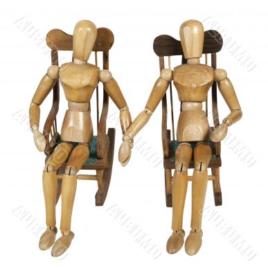 Couple in Rocking Chairs Holding Hands