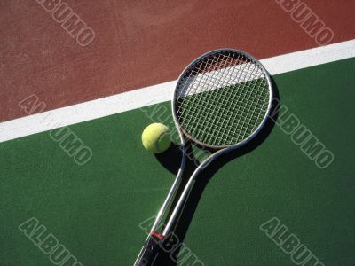 Tennis Ball with Racket on Court