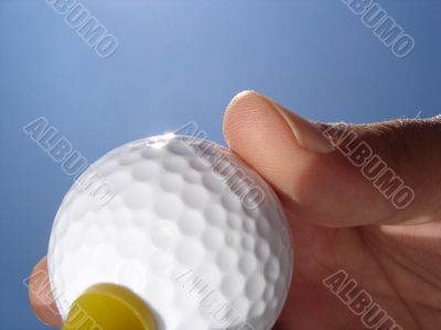 Hand and Golf Ball Closeup