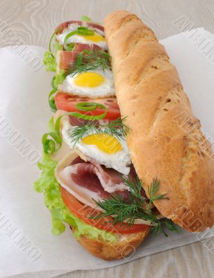  Big sandwich with ham, tomato and quail egg