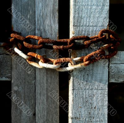 Rusty chains on wood