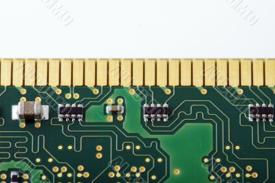 Green computer board with chips and components. 