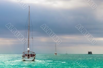 Sailing boat in a azure sea