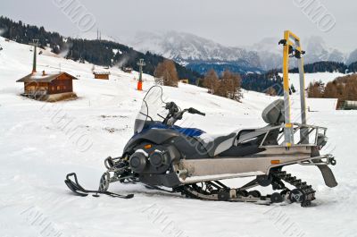 Snowmobile on alps in winter time